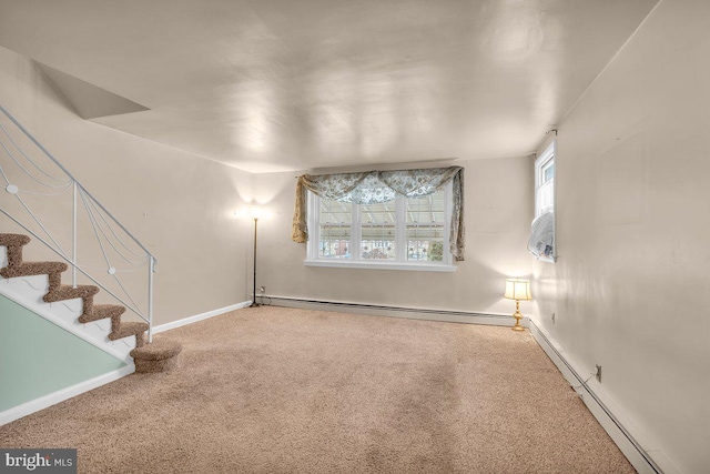 unfurnished room with carpet floors and a baseboard radiator