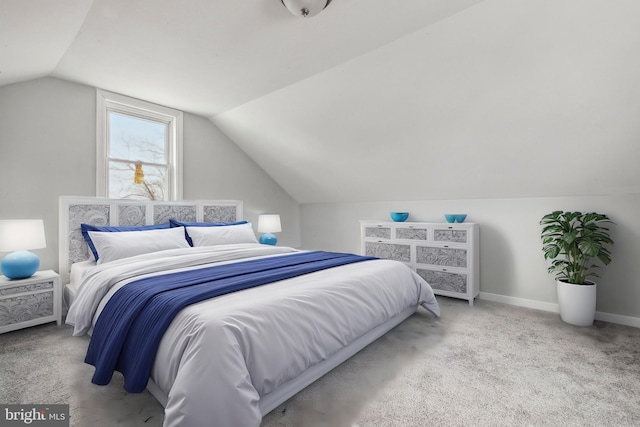 carpeted bedroom featuring vaulted ceiling