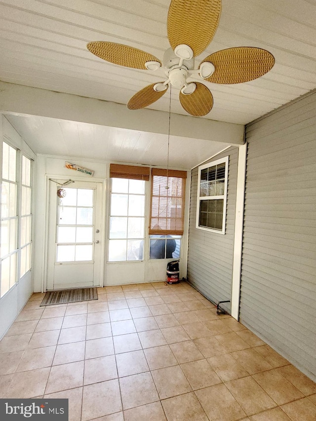 unfurnished sunroom featuring lofted ceiling and ceiling fan