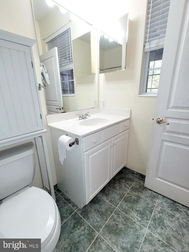 bathroom with vanity and toilet