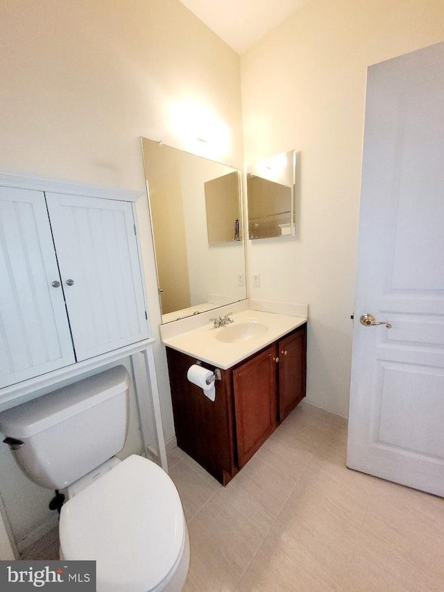 bathroom with toilet and vanity