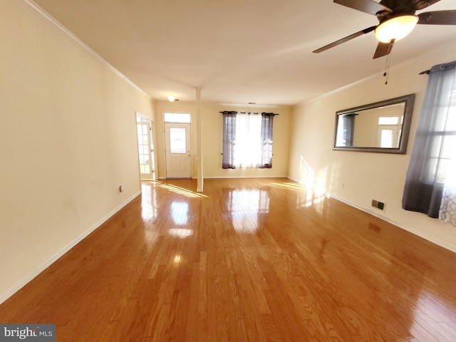 unfurnished room featuring ceiling fan, hardwood / wood-style flooring, and crown molding