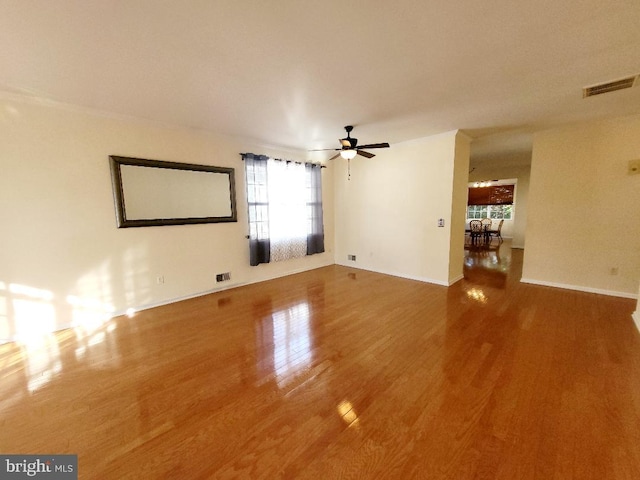 spare room with ceiling fan and wood-type flooring