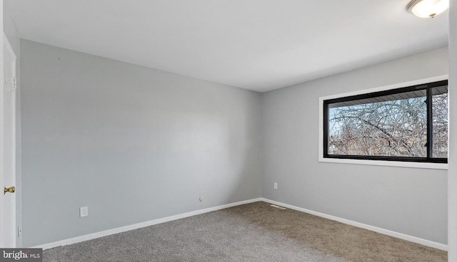 empty room with carpet flooring