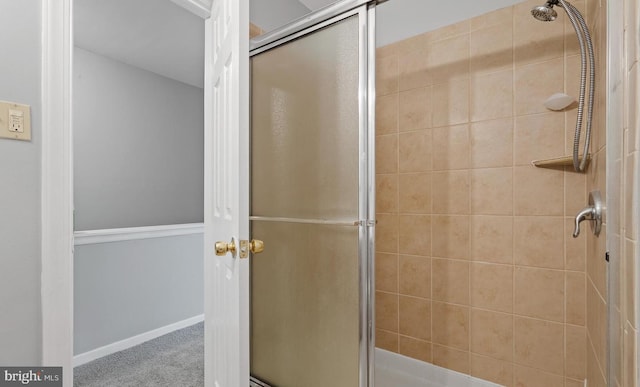 bathroom featuring an enclosed shower