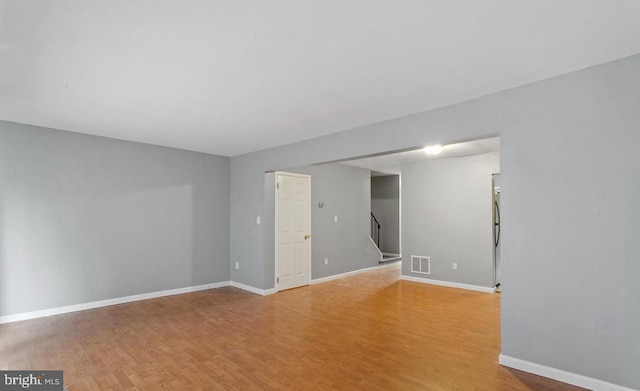 unfurnished room featuring light hardwood / wood-style floors