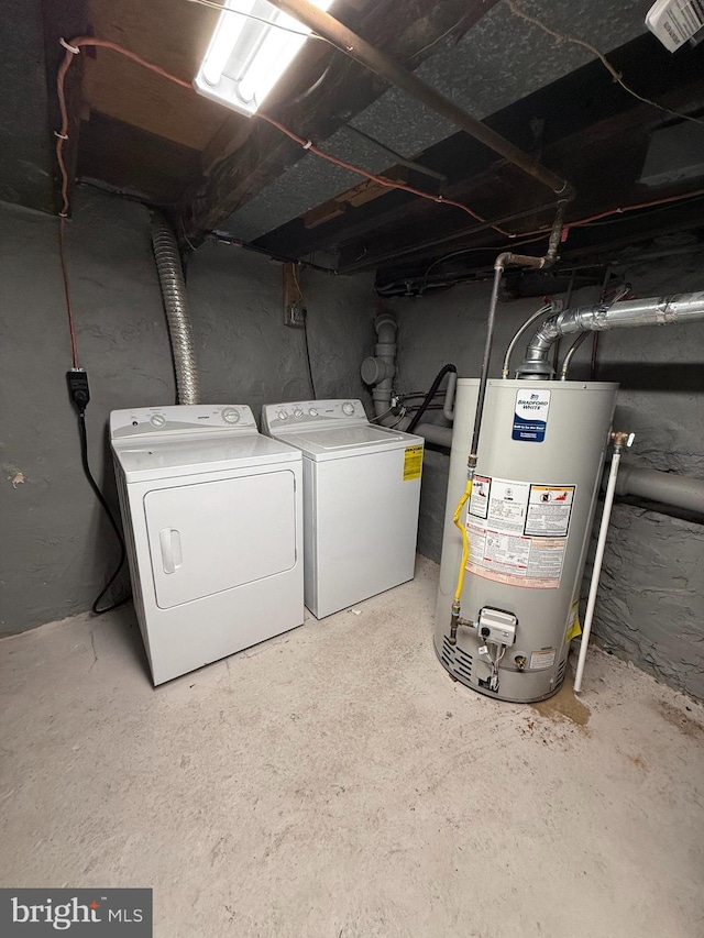 laundry area with washer and clothes dryer and water heater