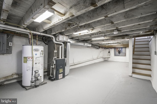 basement with electric panel, heating unit, and water heater