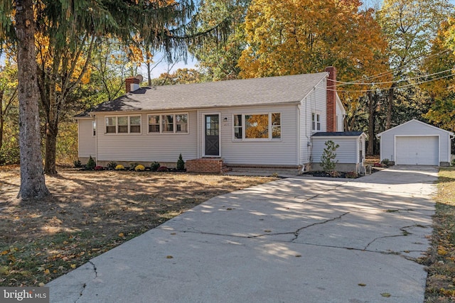 view of front facade featuring a shed and a garage