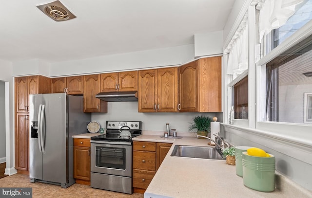 kitchen with sink and appliances with stainless steel finishes