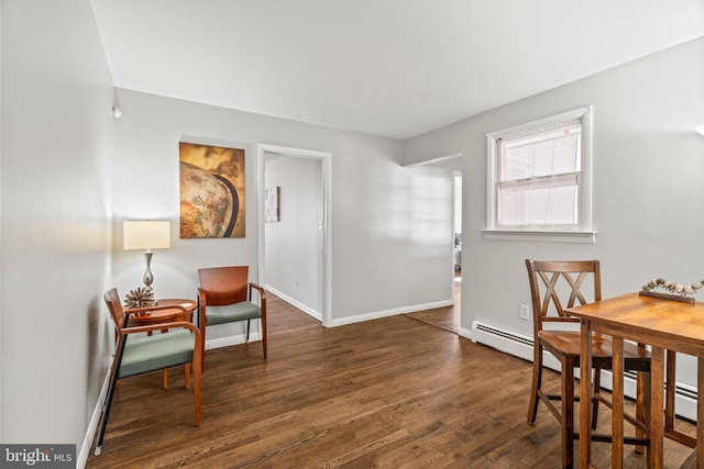 dining space featuring dark wood-type flooring