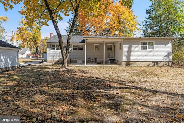 back of property featuring a patio