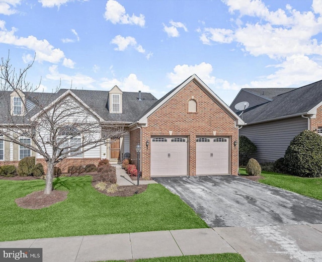 view of front of house with a garage and a front yard