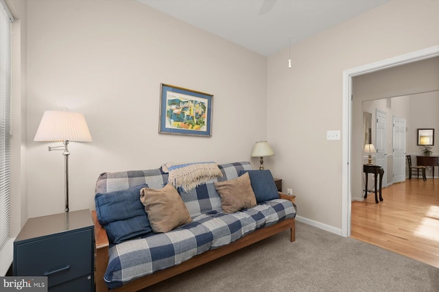 living room featuring carpet floors and ceiling fan