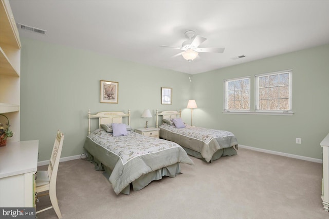 bedroom featuring light colored carpet and ceiling fan