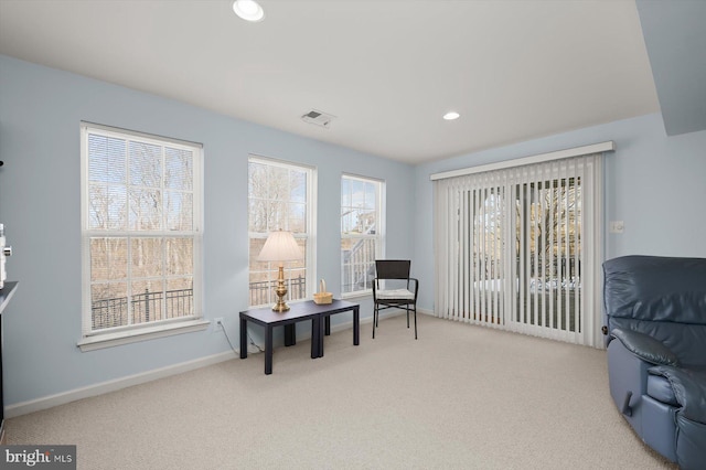 living area with light colored carpet