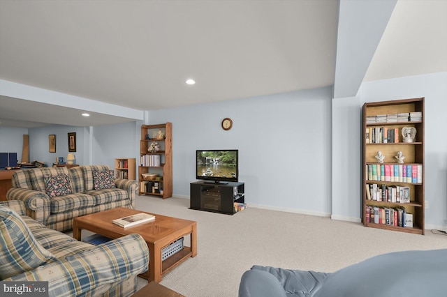 carpeted living room featuring built in features