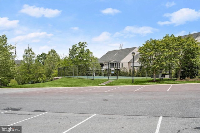 10576 Edwardian Ln Unit 132, New Market, MD 21774 - uncovered parking lot featuring a tennis court and fence