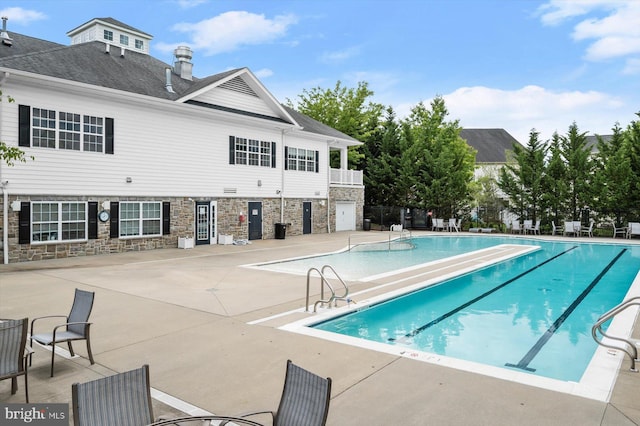 10576 Edwardian Ln Unit 132, New Market, MD 21774 - community pool featuring a patio and fence