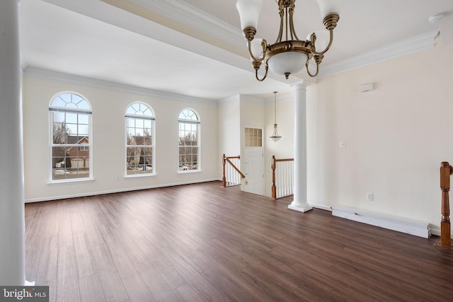 unfurnished living room featuring crown molding, dark hardwood / wood-style flooring, an inviting chandelier, and decorative columns