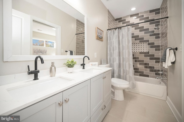 full bathroom featuring shower / bath combo, vanity, toilet, and tile patterned floors