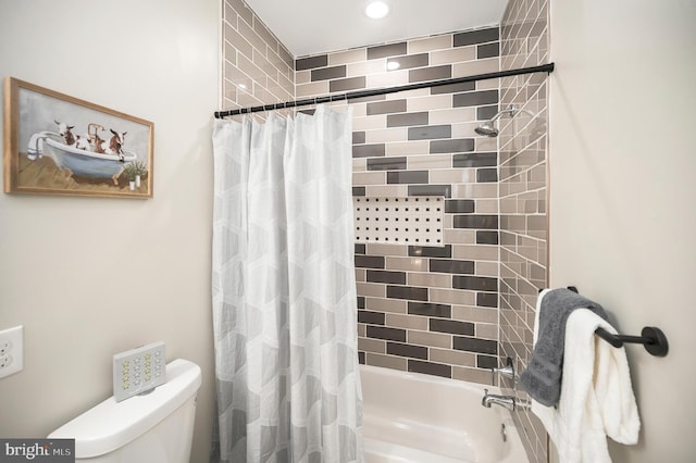 bathroom with toilet and shower / tub combo with curtain