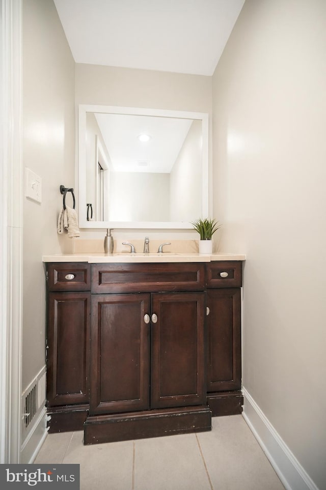 bathroom with tile patterned flooring and vanity