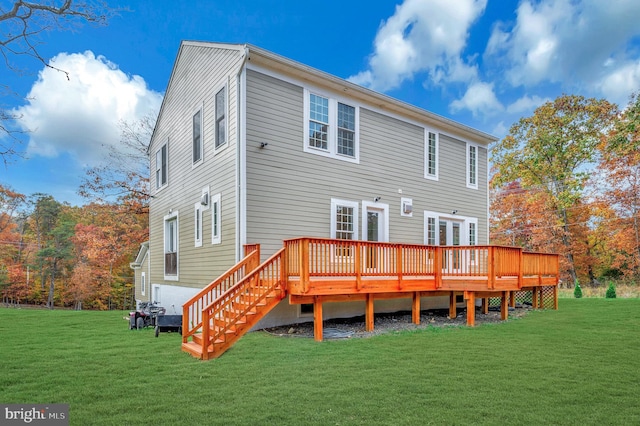 back of property featuring a yard and a deck