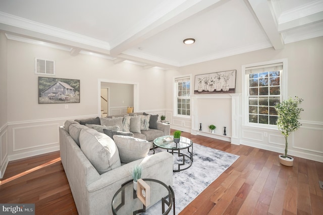 living room with beam ceiling, crown molding, and dark hardwood / wood-style floors