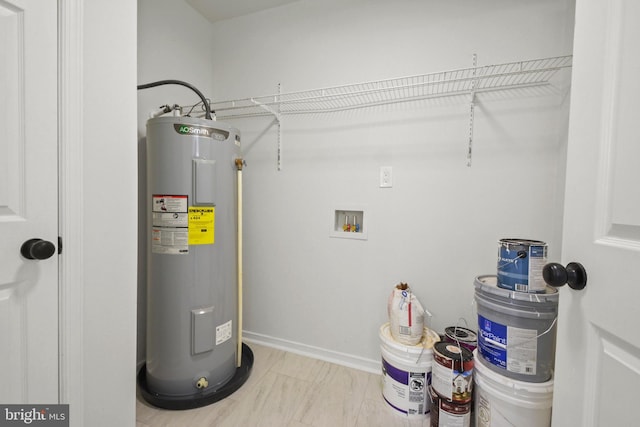 utility room featuring water heater