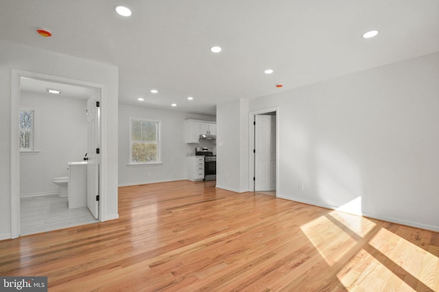 unfurnished living room featuring light hardwood / wood-style floors