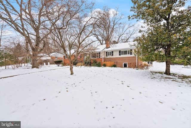 view of yard covered in snow