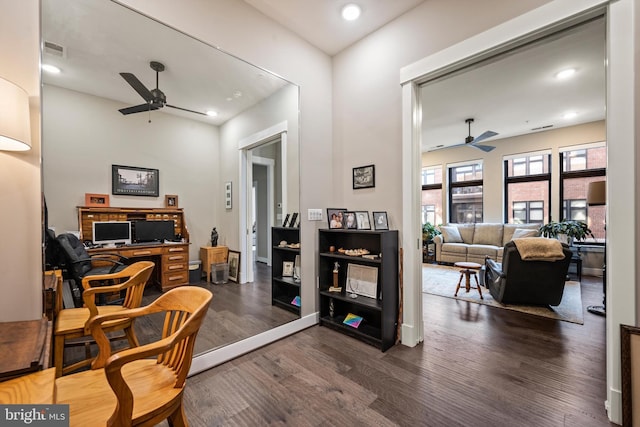 office space featuring dark wood-type flooring and ceiling fan