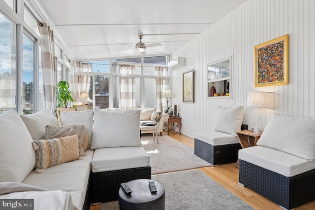 sunroom / solarium featuring vaulted ceiling, a wall mounted AC, and a ceiling fan