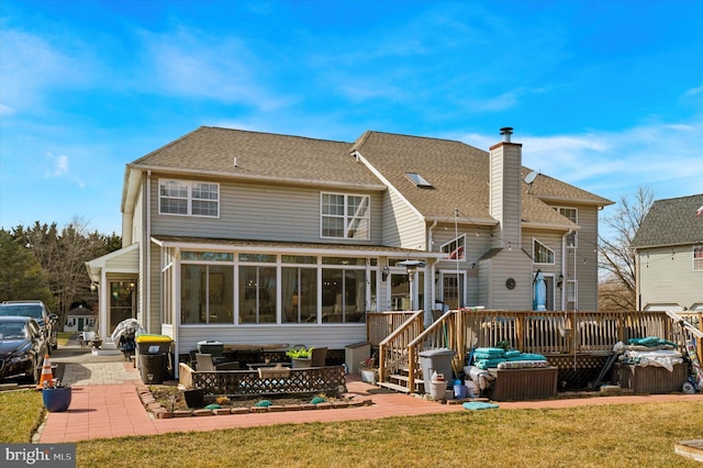 back of house with a patio, a shingled roof, a sunroom, a yard, and a wooden deck