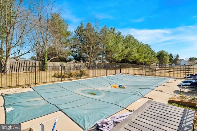 view of swimming pool with a patio area, fence, and a fenced in pool