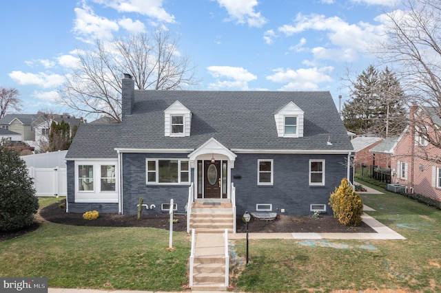 new england style home featuring a front yard and central air condition unit