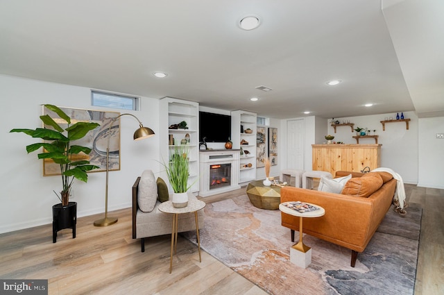 living room with light hardwood / wood-style flooring