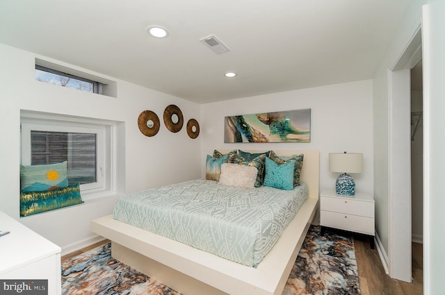 bedroom with hardwood / wood-style floors