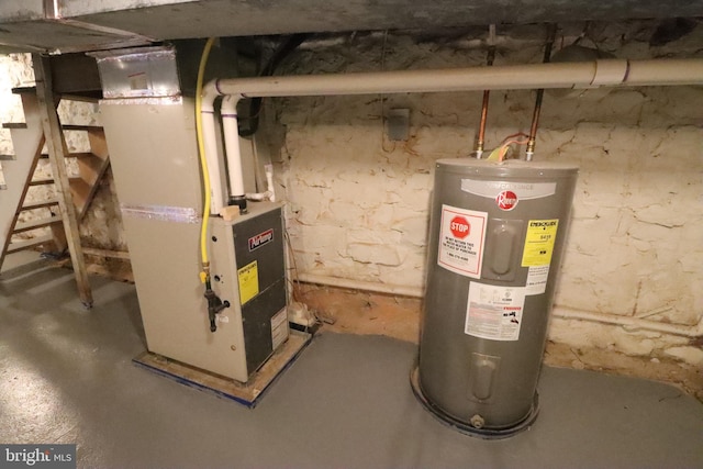 utility room featuring electric water heater and heating unit