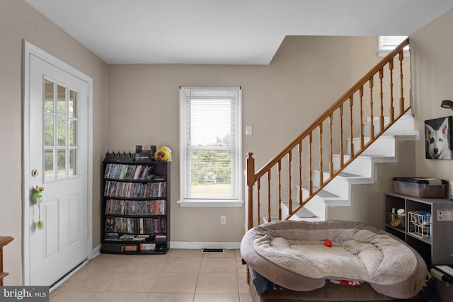 entrance foyer featuring light tile patterned flooring