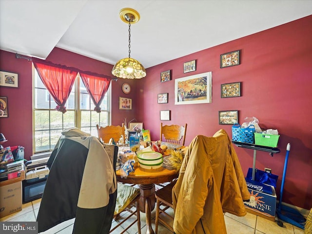 dining space featuring light tile patterned floors