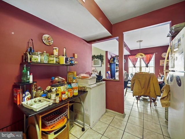 kitchen featuring white refrigerator and light tile patterned floors