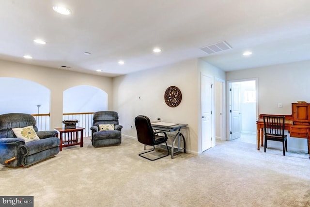 living area with light carpet