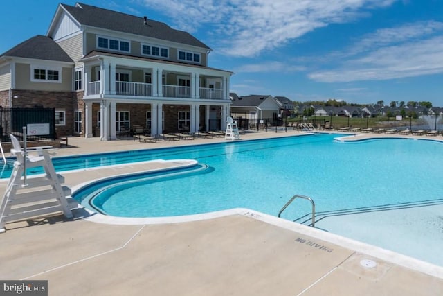 view of swimming pool with a patio area