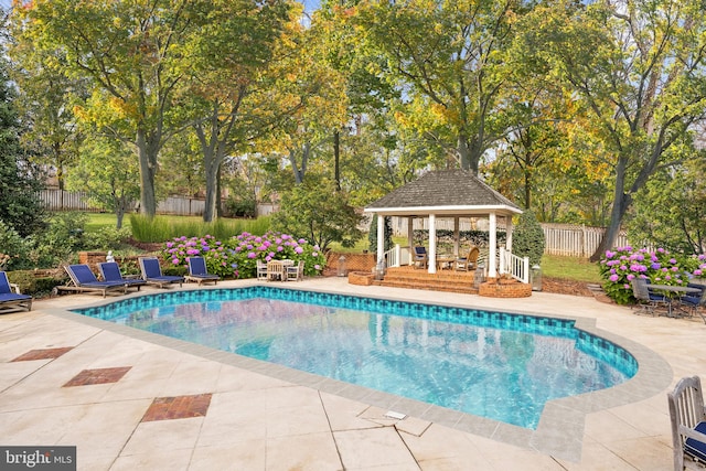 view of pool with a fenced in pool, a patio area, fence, and a gazebo