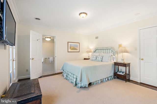 bedroom featuring baseboards, visible vents, and crown molding