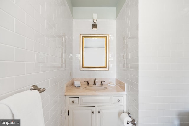 bathroom with tile walls and vanity