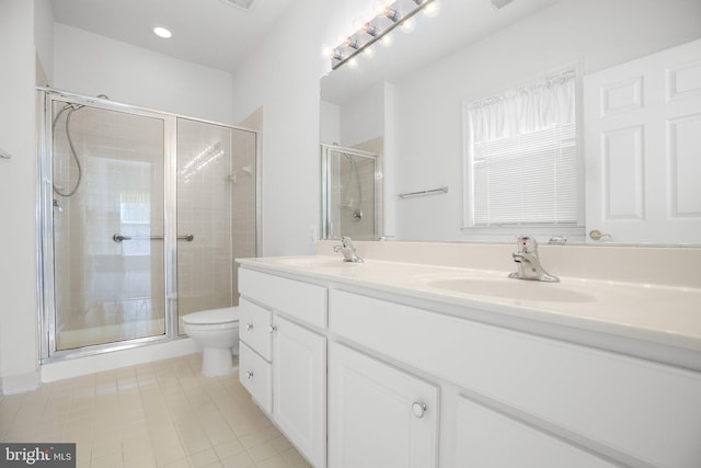 bathroom with vanity, toilet, and walk in shower