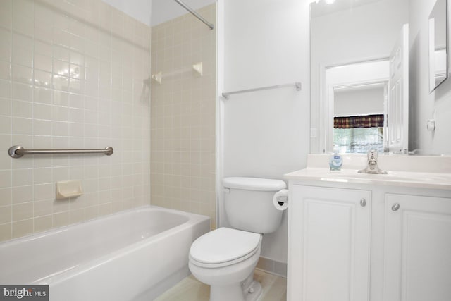 full bathroom featuring vanity, toilet, and tiled shower / bath combo